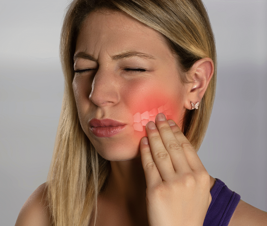 "Man in his 40s checking his teeth in the mirror with concern"